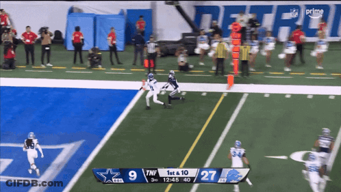 A Football Game Between The Cowboys And The Lions With The Score 9 To 27 GIF