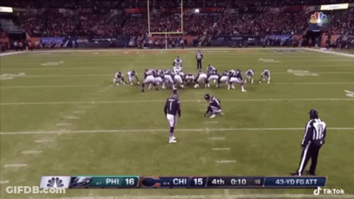 A Football Game Between The Eagles And The Patriots GIF
