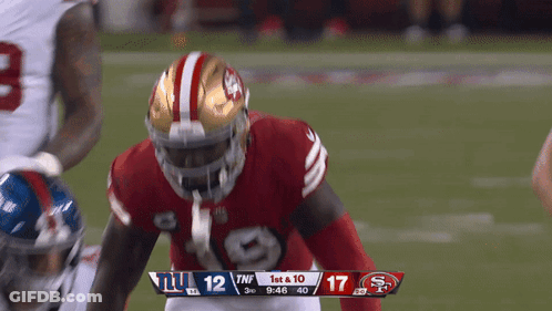 A Football Game Between The Giants And 49Ers GIF