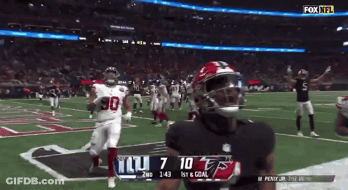 A Football Game Between The Giants And The Falcons GIF