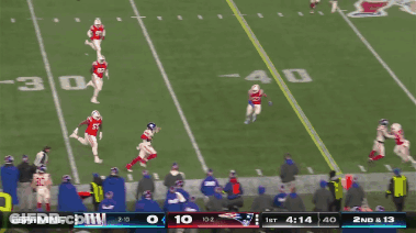A Football Game Between The Giants And The Patriots Is Going On GIF