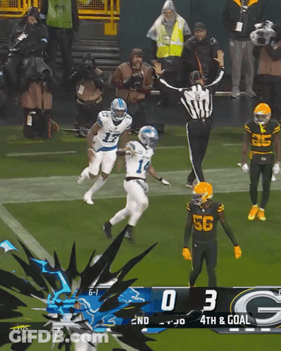 A Football Game Between The Green Bay Packers And The Detroit Lions Is In Progress GIF