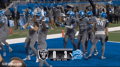 A Football Game Between The Raiders And The Lions GIF