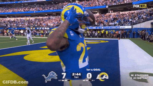 A Football Game Between The Rams And Detroit Lions GIF