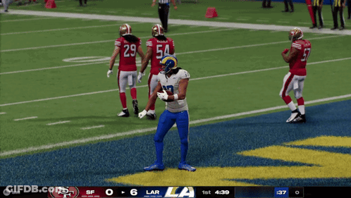 A Football Game Between The Rams And The 49Ers GIF