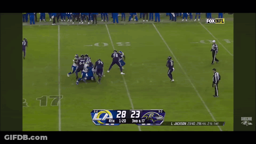 A Football Game Between The Rams And The Ravens GIF