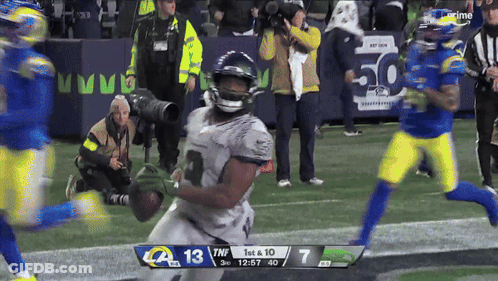 A Football Game Between The Rams And The Seahawks Is Being Played GIF