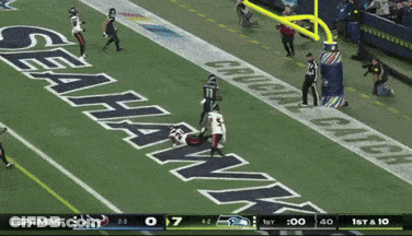 A Football Game Between The Seahawks And The Cowboys GIF