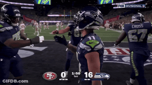 A Football Game Between The Seahawks And The San Francisco 49Ers GIF