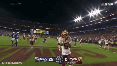 A Football Game Between The Seahawks And The Was GIF