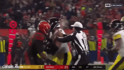 A Football Game Between The Steelers And The Browns GIF