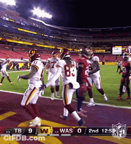 A Football Game Between The Washington Redskins And The Denver Broncos GIF
