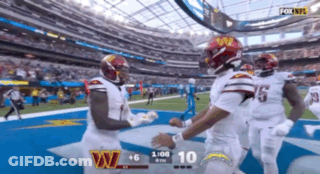 A Football Game Between The Washington Redskins And The La Chargers GIF