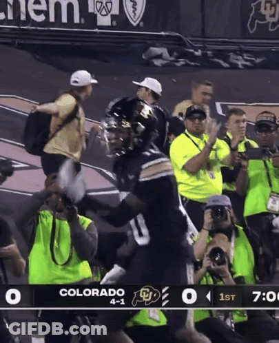 A Football Game Is Being Played Between Colorado And Ucla GIF