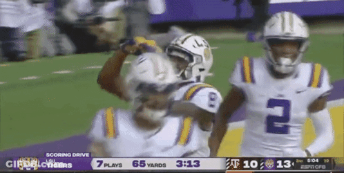 A Football Game Is Being Played Between Lsu And Texas Tech GIF