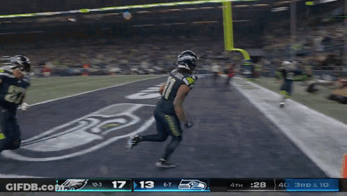 A Football Game Is Being Played Between Seattle Seahawks And Eagles GIF