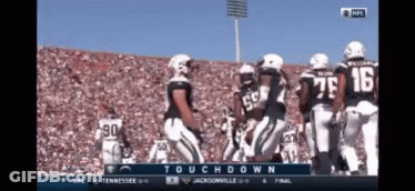 A Football Game Is Being Played Between Tennessee And Jacksonville On A Television Screen GIF