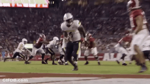 A Football Game Is Being Played Between The Alabama And Florida State Teams GIF