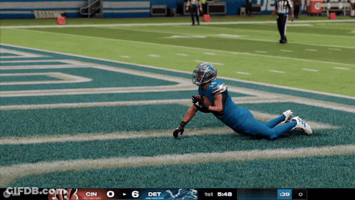 A Football Game Is Being Played Between The Detroit Lions And The Cincinnati Bengals GIF
