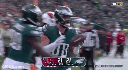A Football Game Is Being Played Between The Eagles And The Redskins GIF