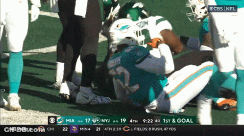 A Football Game Is Being Played Between The Miami Dolphins And New York Jets GIF