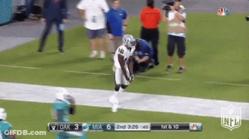 A Football Game Is Being Played Between The Raiders And The Dolphins GIF