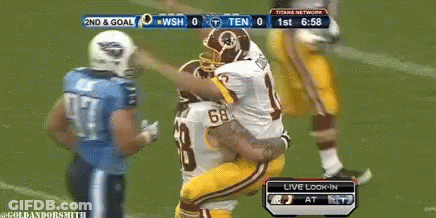 A Football Game Is Being Played Between The Redskins And The Titans GIF
