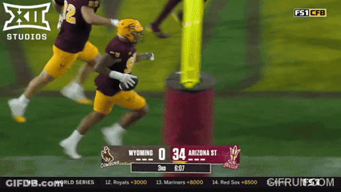 A Football Game Is Being Played Between Wyoming And Arizona St GIF