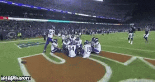 A Football Game Is Being Played In A Stadium And A Gif Is Being Displayed On Imgflip.com GIF
