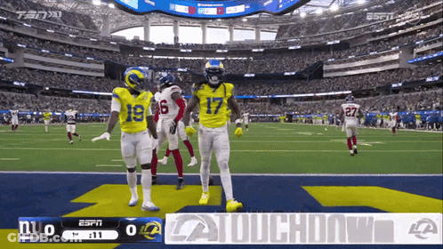 A Football Game Is Being Played In A Stadium And The Score Is 0 To 0 GIF