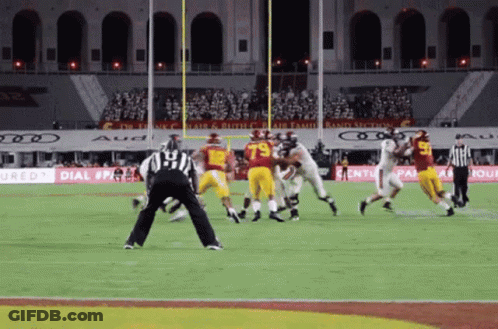 A Football Game Is Being Played In A Stadium That Has Ads For Audi GIF