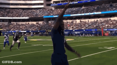A Football Game Is Being Played In A Stadium That Has The Word Cowboys On The Scoreboard GIF
