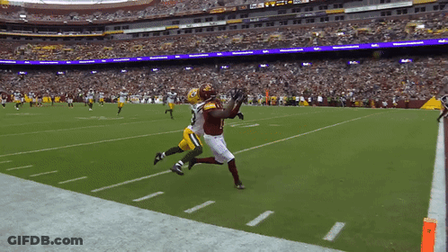 A Football Game Is Being Played In A Stadium With A Fedex Sign In The Background GIF