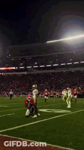A Football Game Is Being Played In A Stadium With A Few Players On The Field GIF