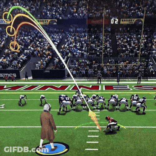 A Football Game Is Being Played In A Stadium With A Scoreboard That Says 20 On It GIF