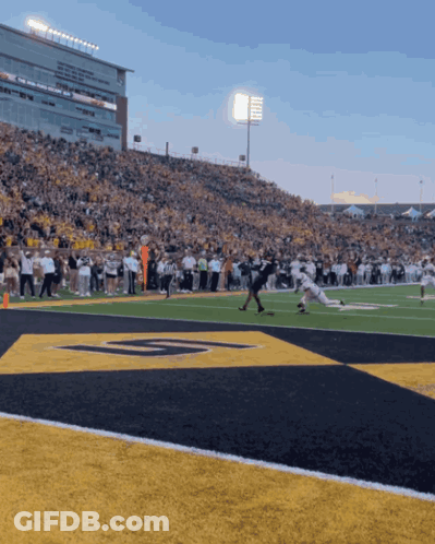 A Football Game Is Being Played In A Stadium With The Letter G On The Field GIF
