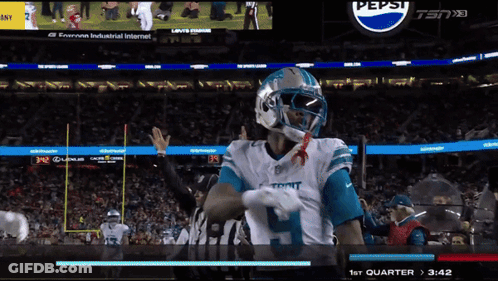 A Football Game Is Being Played In Front Of A Pepsi Ad GIF
