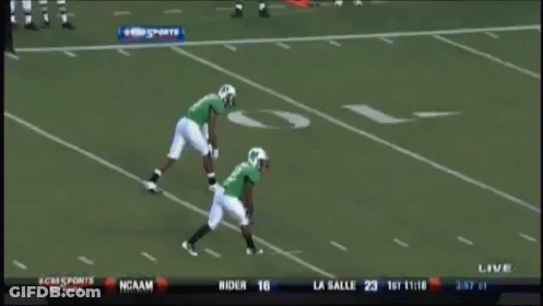 A Football Game Is Being Played In Front Of A Pepsi Banner GIF
