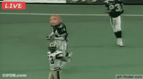 A Football Game Is Being Played Live And The Referee Has The Number 53 On His Back GIF