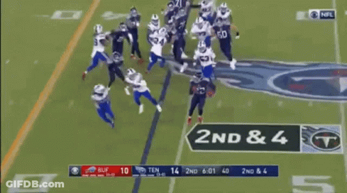 A Football Game Is Being Played On A Field And A Player Is Being Lifted By A Target . GIF