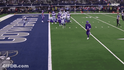 A Football Game Is Being Played On A Field That Says Cowboys On It GIF