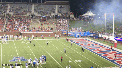 A Football Game Is Being Played On A Field That Says Texas Tech On It GIF