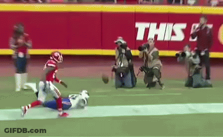 A Football Game Is Being Played On A Field With A Banner That Says This On It GIF