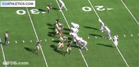 A Football Game Is Being Played On A Field With A Kuathletics.com Logo In The Corner GIF