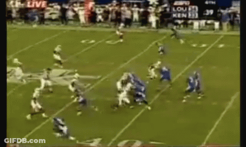 A Football Game Is Being Played On A Field With A Scoreboard That Says 39 GIF