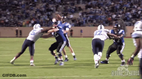 A Football Game Is Being Played On A Field With Duke Ebs Video Written On The Bottom GIF