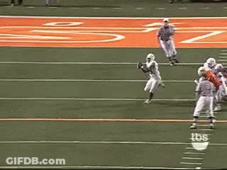 A Football Game Is Being Played On A Field With Tbs Written On The Sidelines GIF