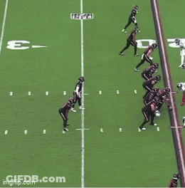 A Football Game Is Being Played On A Field With The Letter E In The Middle GIF