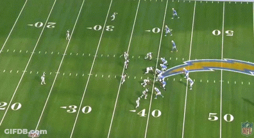 A Football Game Is Being Played On A Field With The Number 30 On It GIF