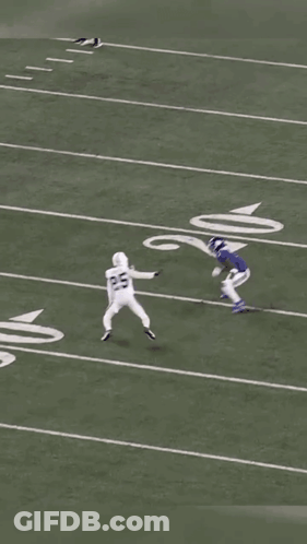 A Football Game Is Being Played On A Field With The Number 6 On The Sideline GIF
